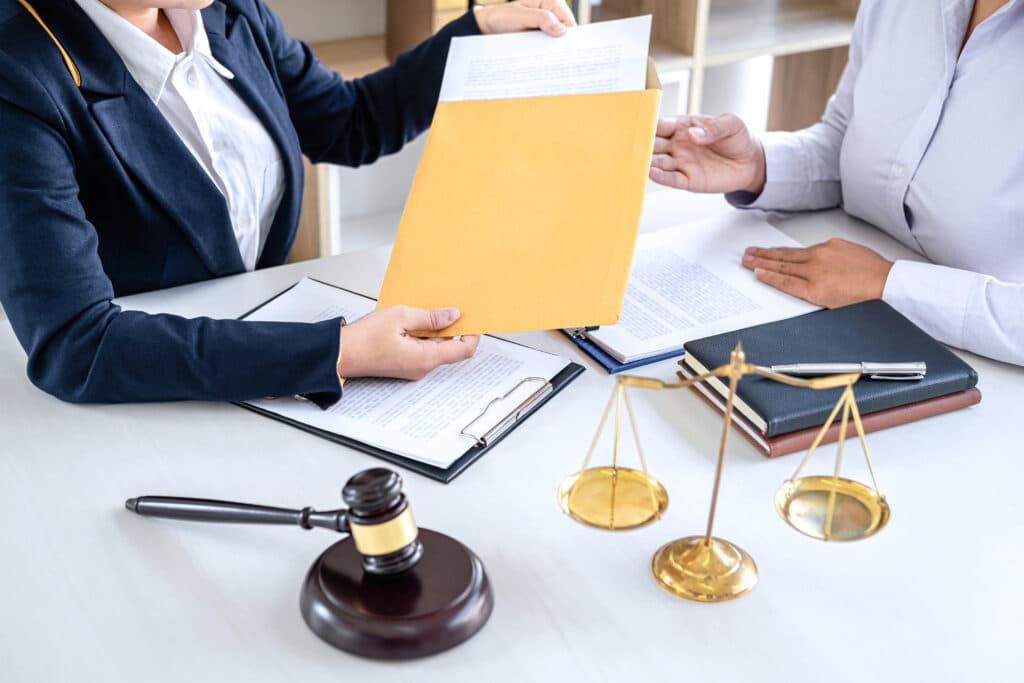 Woman Giving Envelop - Will an Inheritance Affect My Social Security Retirement Benefits