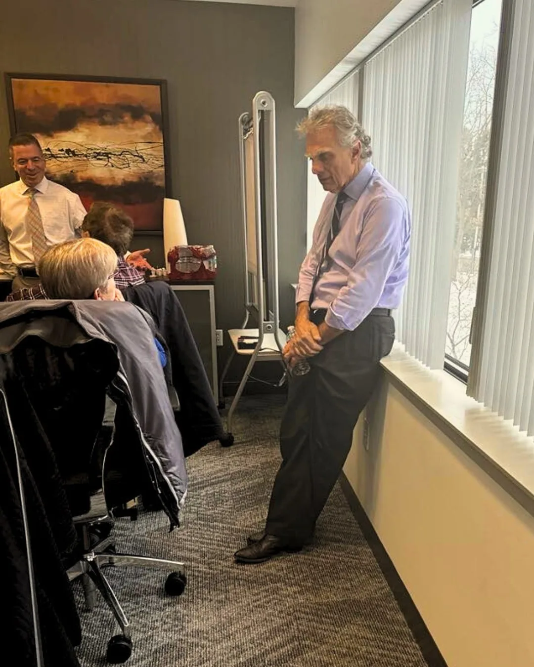 Paul consulting with a small group